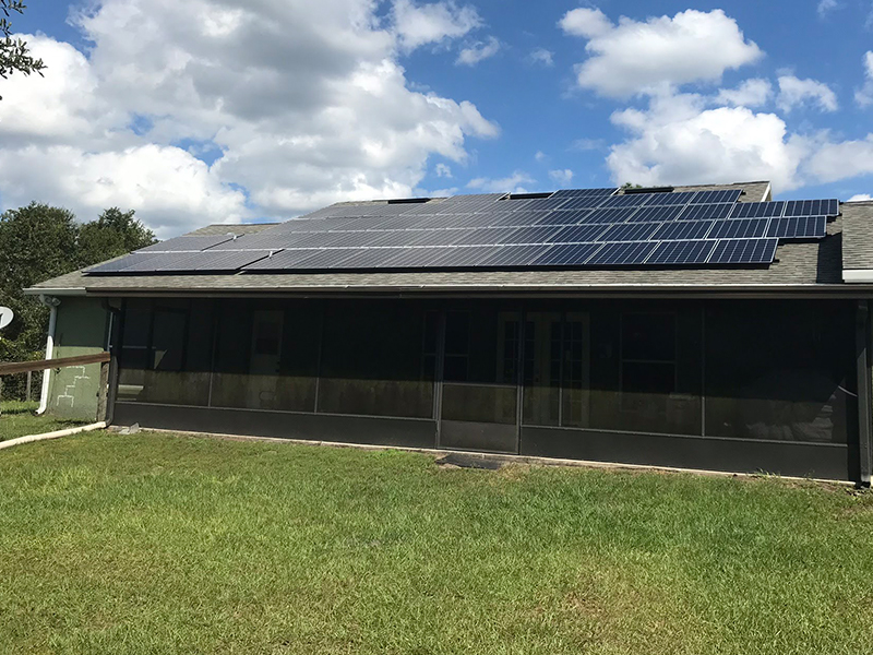 solar panels on one side of a house using energy from sun to power the house