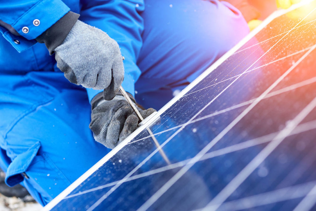 tightened solar panel onto roof